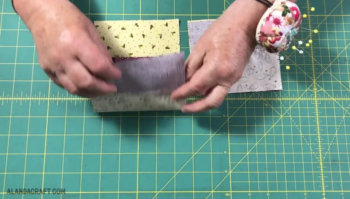 Pin the pieces together, ensuring seams align. Check for accurate seam matching.