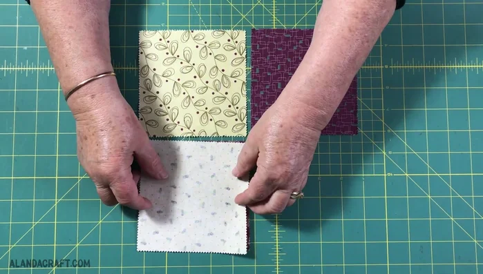 Pair one light and one dark square, right sides together. Sew along one edge with a 1/4 inch seam. Repeat for the other pair. Chain piece to save time.