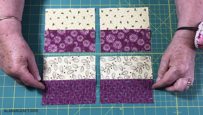 Lay the resulting four strips face up, matching light and dark colors. Overlap the pairs, ensuring light and dark colors align.