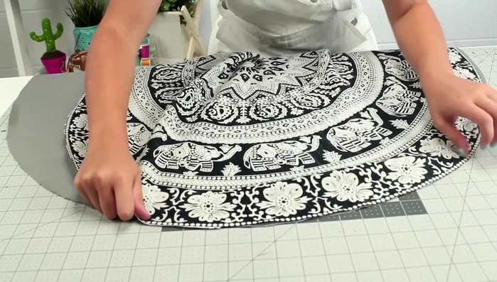Place the tapestry and fabric circles right sides together. Clip them together.