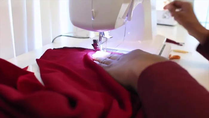 Sew the center back seam of the dress.