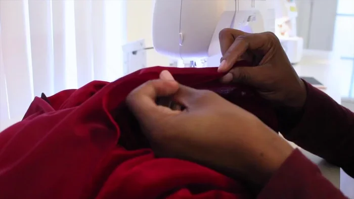 Hem the bottom of the dress.