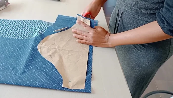 Cut Sleeves: Cut out sleeves using a pre-existing sleeve pattern.