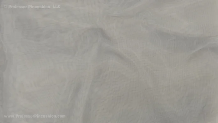 Use a sew-in interfacing (such as silk or polyester organza) for stability.