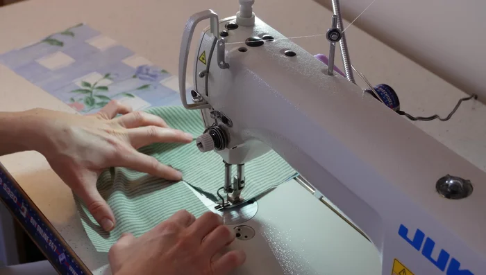 Gather the loop: Sew two parallel gathering stitches along the top edge of the loop. Pull threads to gather.