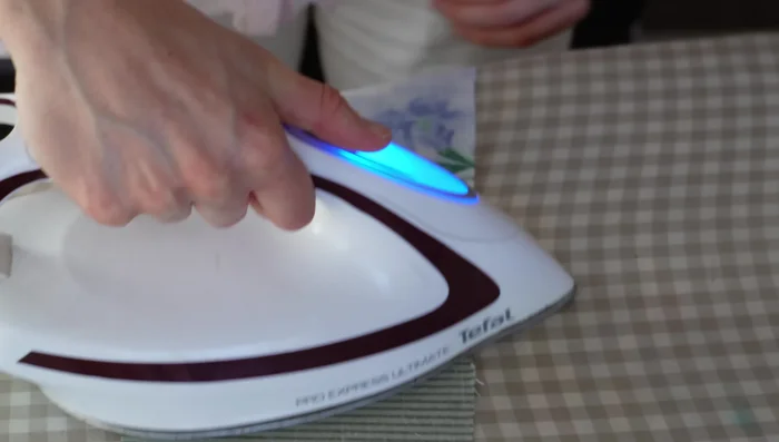 Gather the loop: Sew two parallel gathering stitches along the top edge of the loop. Pull threads to gather.