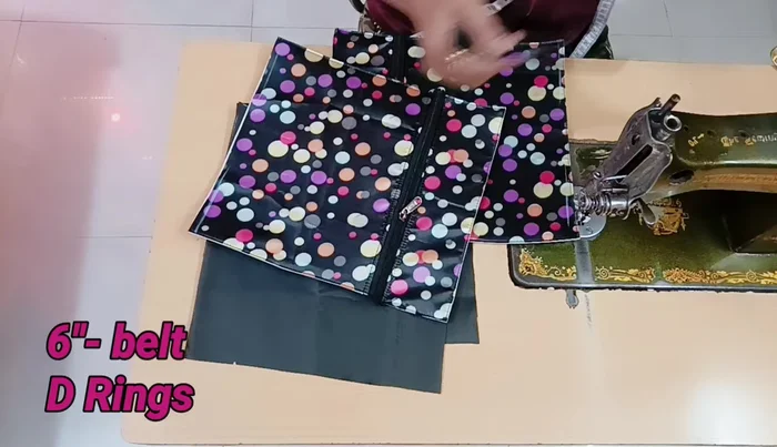 Sew the base piece to the main fabric pieces: Attach the 11x18 inch pieces, with the zippers attached, to the main fabric.