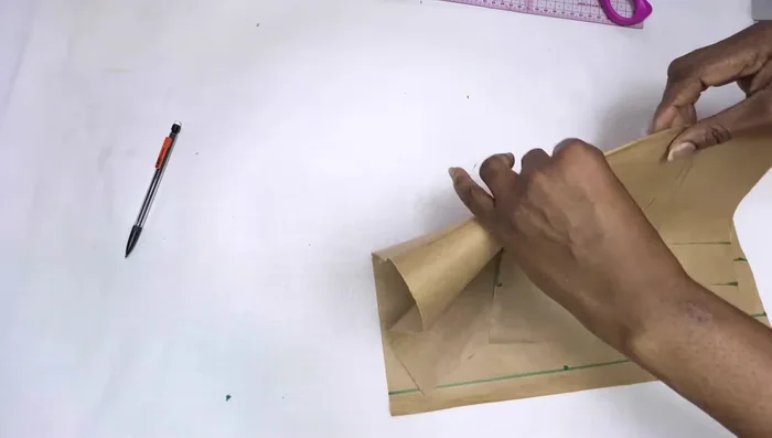 Cut out the front and back bodice pieces, adding seam allowances (neckline, armhole, side seam, and bottom hem).