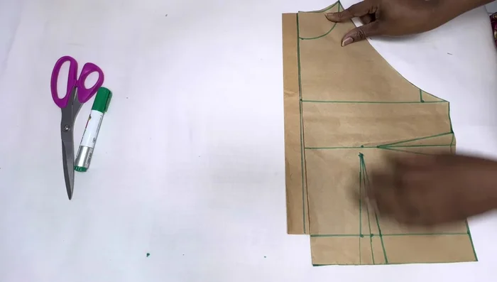 Cut out the front and back bodice pieces, adding seam allowances (neckline, armhole, side seam, and bottom hem).