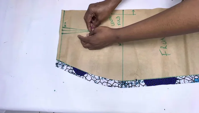 Transfer all marked points (bust points, waist points, etc.) to the fabric pieces using pins and chalk or a marker.