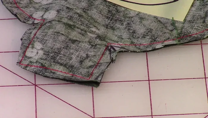 Make small cuts along the curved edges to help the fabric lie flat.