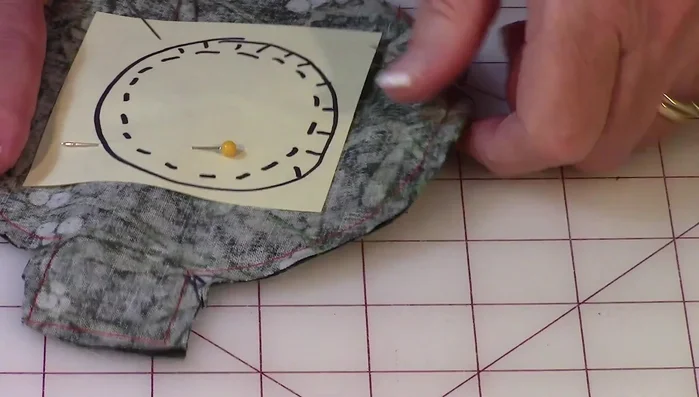 Make small cuts along the curved edges to help the fabric lie flat.