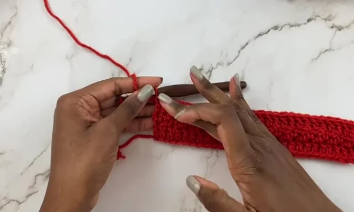 Repeat Rows 2 and 3 until the scarf reaches the desired length (approximately 55 inches).