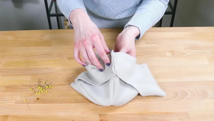 Pin the top and bottom pieces together (right sides facing), aligning seams and ensuring ear flaps face up. Sew all the way around.