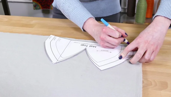 Cut two 1-inch wide by 18-inch long fleece strips for the ties.