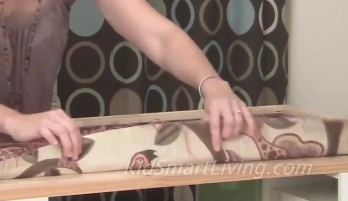 Work from the middle of each side towards the corner to maintain tension and a smooth finish.