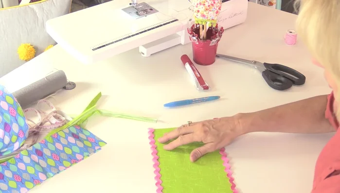 Attach rickrack (optional): Sew rickrack to the decorative fabric strips, then fold over and topstitch for a frilled effect.