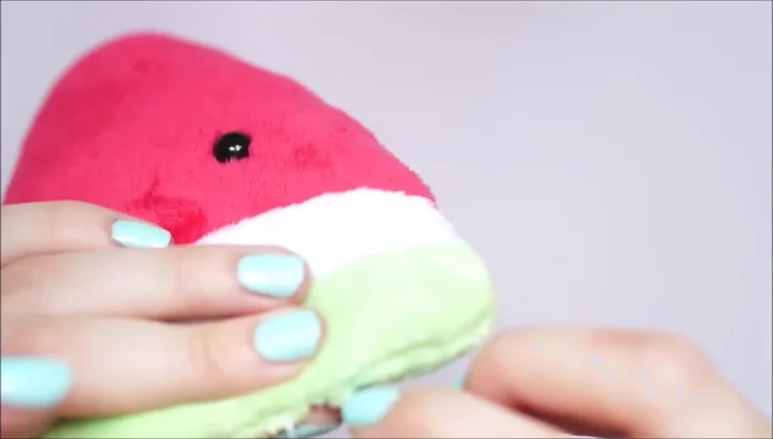 Sew a mouth using black needle and thread.