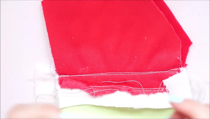 Trim excess fabric and turn the plush inside out.