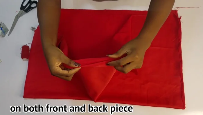 Hem the top and bottom of the front and back pieces.