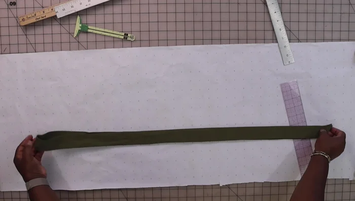 Create your pattern: a long rectangle with seam allowance (double the desired width + 1 inch). Consider a pointed or straight end.