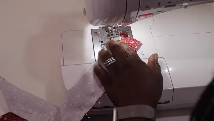 Sew the seam, carefully pivoting at the corner to create a sharp point. Backstitch at the beginning and end of each seam.