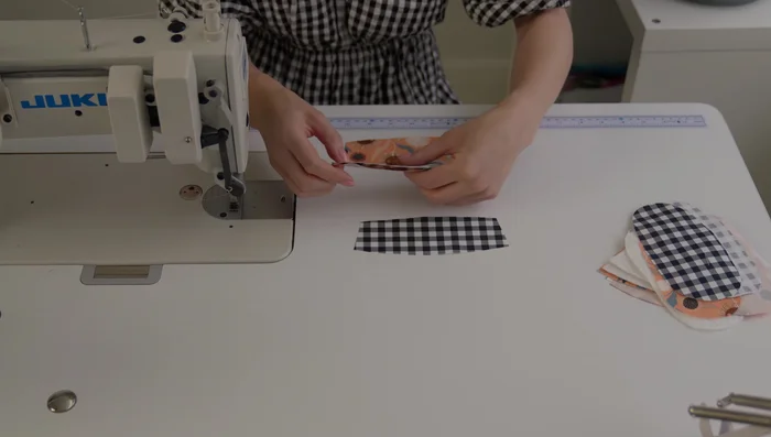 Create a casing for elastic: Stitch 3/8 inch away from the pressed seam. Thread elastic through the casing using a safety pin and secure both ends.