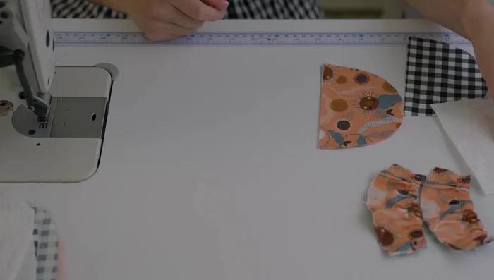 Trim padding and press seams: Trim the padding close to the seam to reduce bulk. Press the seams of the upper slipper for a smooth finish.