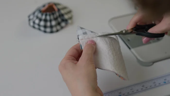 Trim padding and press seams: Trim the padding close to the seam to reduce bulk. Press the seams of the upper slipper for a smooth finish.