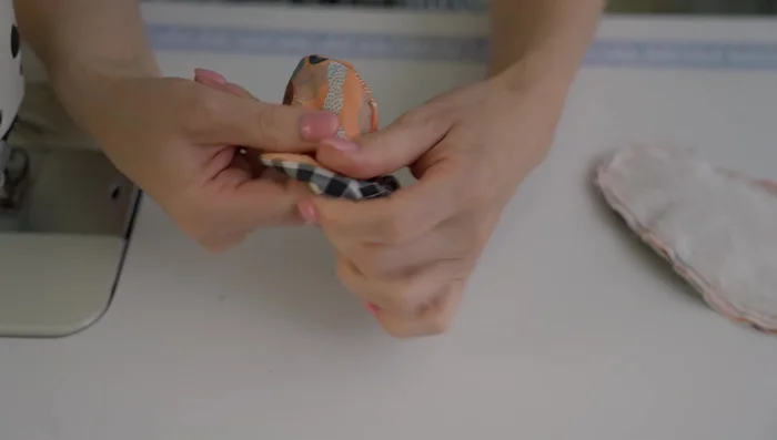 Turn and finish: Turn the slippers inside out through the opening. Use an invisible stitch to close the opening. Stuff the toe with soft fabric and steam to shape.