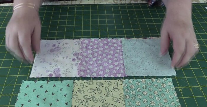 Place the finished square piece on top of the batting, and pin in place.