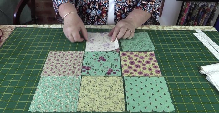 Place the finished square piece on top of the batting, and pin in place.