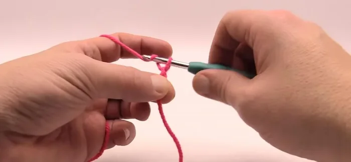 Single crochet across the foundation chain (working in the second chain from the hook). Repeat this for one more row to create a solid base for the graphghan.