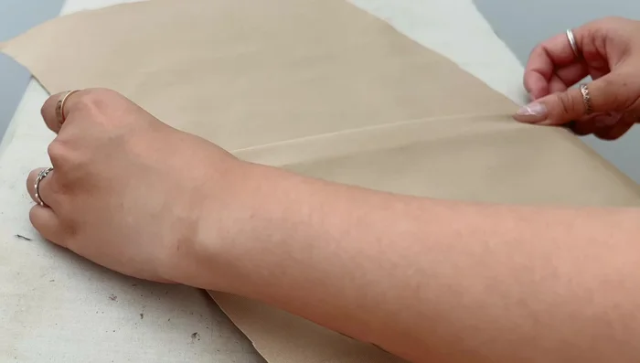 Pin or stay stitch pleats ⅛ inch from the top to secure them.