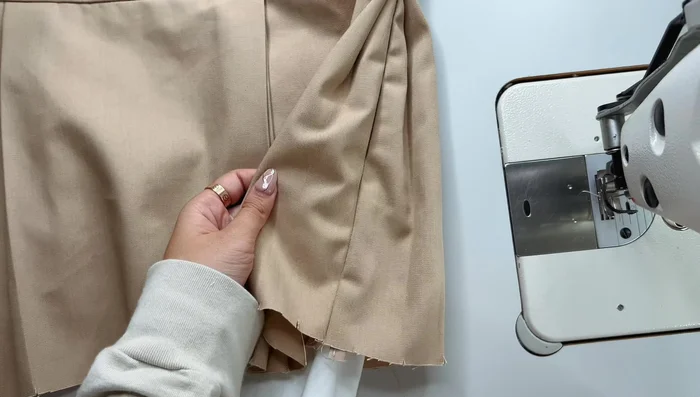 Sew down the lining yoke along the zipper, trim corners, turn right side out, and press the seam allowance.