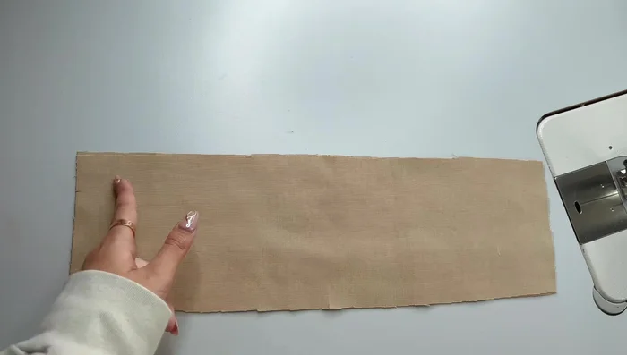 Sew down the lining yoke along the zipper, trim corners, turn right side out, and press the seam allowance.