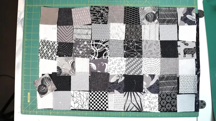 Sew together scrappy squares to create a background.