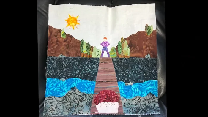 Arrange shapes on a solid background fabric.