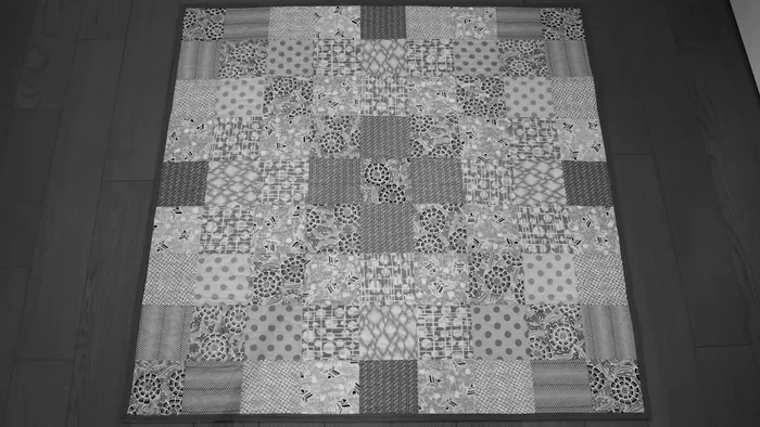 Take a black and white photo of your quilt to assess value and contrast.