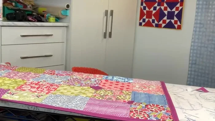 Fuse the chosen fabric scraps to the quilt.