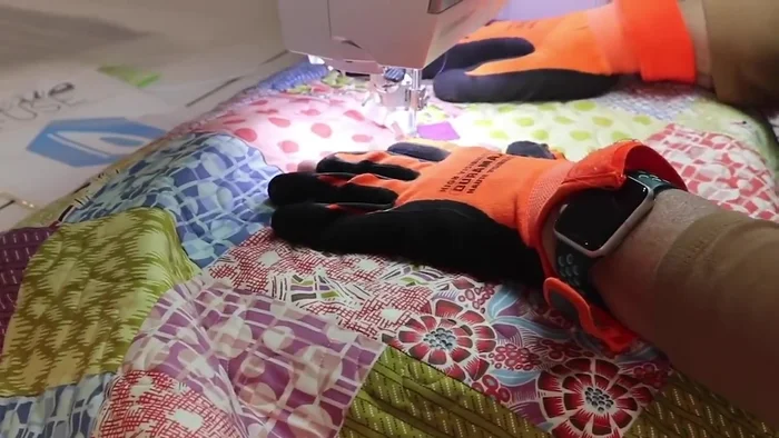 Sew the patches in place, adding texture and design with quilting and thread.