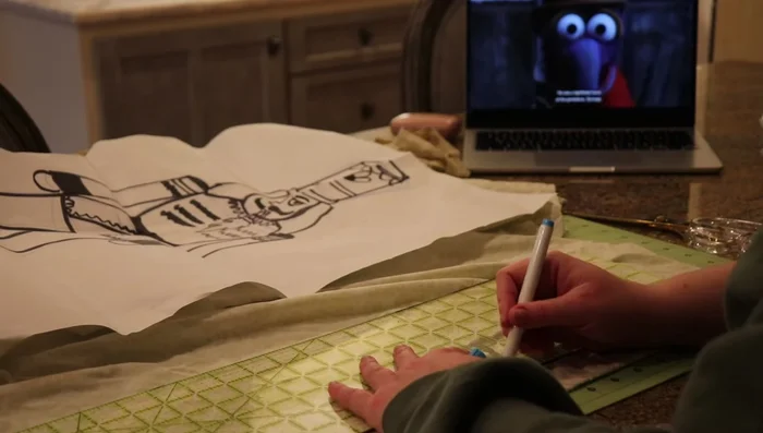 Cut out fabric pieces, adding seam allowance. Mark details with markers.