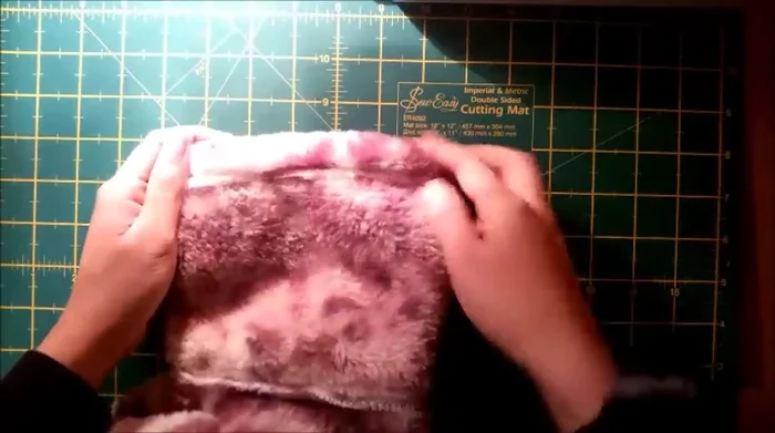 Finish the slippers. Trim any excess thread. Check that the slippers are the correct size and shape.