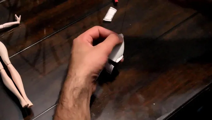 Fit the costume to the doll and adjust seams as needed.