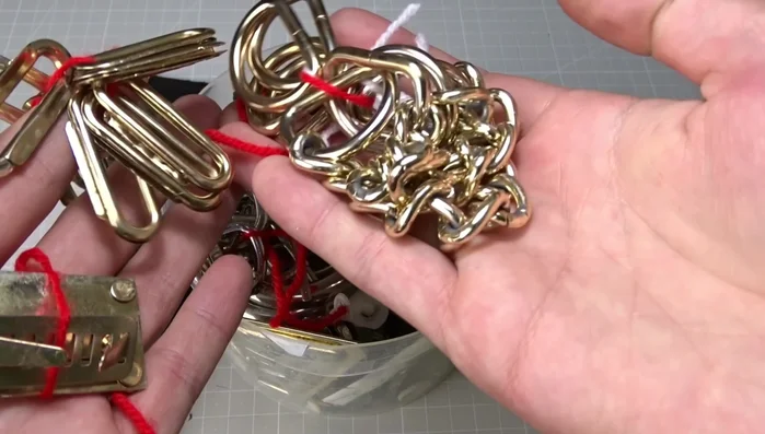 Position straps between leather pieces, ensuring they're centered and visible only at the ends. Sew around the pillow again, carefully managing the thickness of the materials and making notches to reduce bulk.