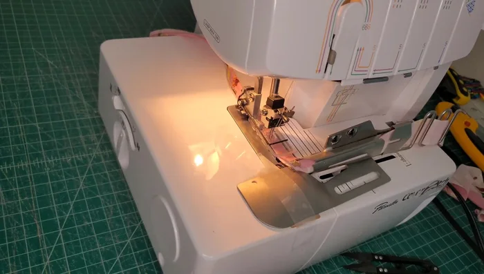 Finish Binding: Continue feeding the binding around the garment, keeping an eye on the tail and stretching as needed to match raw edges. Finish the binding at the starting point.