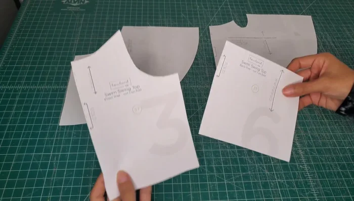 Prepare Pattern Pieces: Tape together non-directional fabric pattern pieces for efficient cutting.