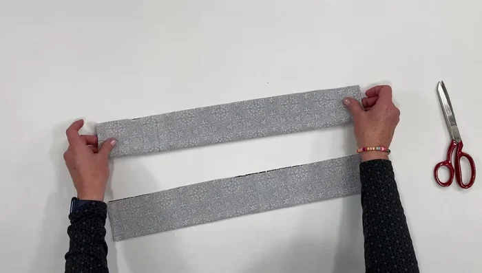 Sew a seam along the long edge of each strip using a serger or stretch stitch.