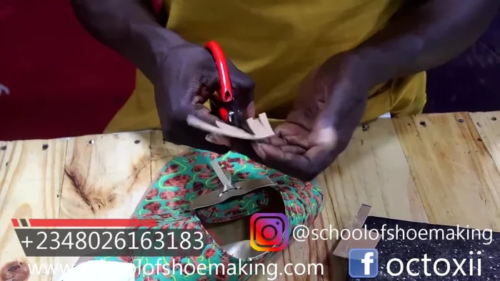 Once dry, trim any excess fabric from the edges. The presenter mentions cutting at the center but also considers alternatives at the sides.