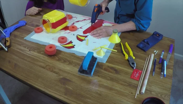 Use Sugru (moldable waterproof glue) to attach the remaining embellishments. Allow 24 hours to cure.